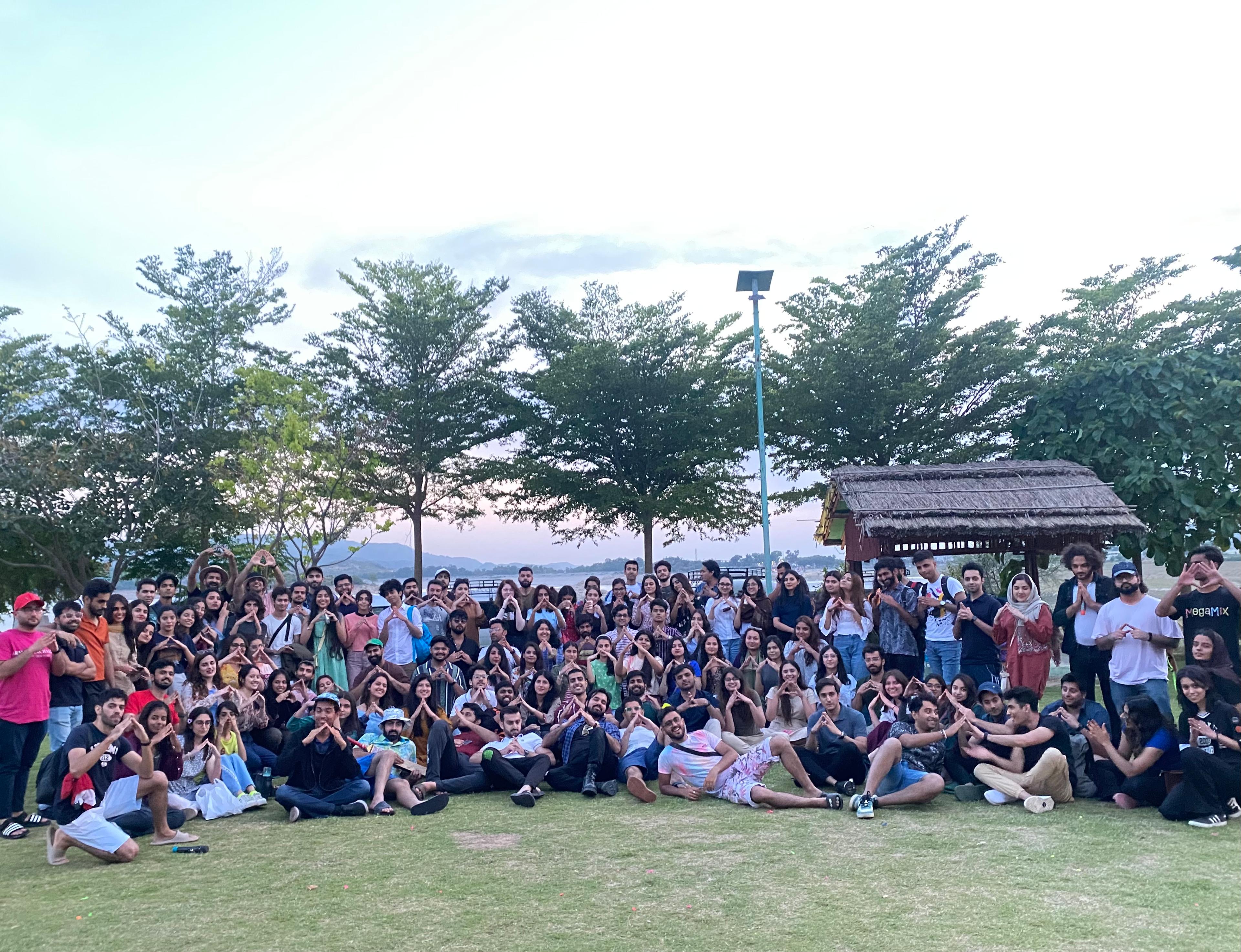 Group photo in front of a traditional mountain lodge